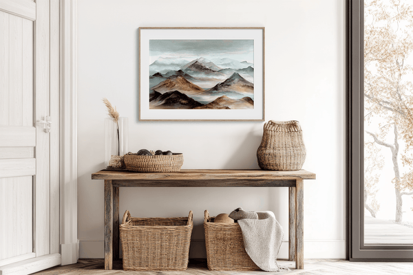 Framed wall art of watercolour mountain print in soft blues and greys. A quiet, misty landscape for calm interiors.