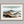 Framed wall art of watercolour mountain print in soft blues and greys. A quiet, misty landscape for calm interiors.