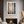 Framed wall art of birch trees in soft autumn light. Crimson and amber leaves drift in golden calm. A tranquil seasonal print.