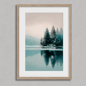 Framed fine art print of a snowy forest reflected in a frozen lake. A serene winter landscape, printed on archival paper and ready to hang.
