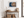 Horizontal tree ring wall art styled in a calm neutral interior