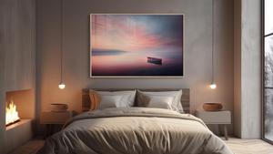 Modern bedroom with a large painting  of a rowboat at sunset above the bed. www.atelierlumin.art