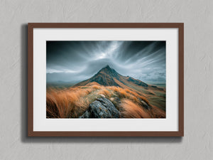Highland Storm shown in a walnut frame with a white border or mount.