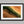 Edge of the Oasis shown in a black frame with a white border or mount.