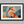 Ember Fox shown in a black frame with a white border or mount.