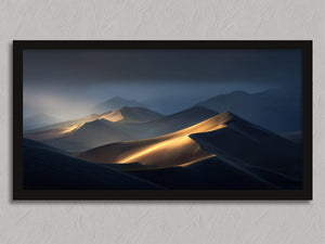 Light Across the Dunes shown in a black frame without a border or mount.