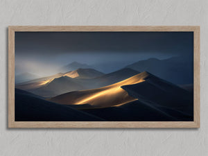 Light Across the Dunes shown in an oak frame without a border or mount.