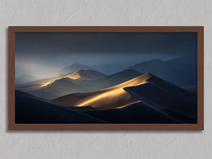 Light Across the Dunes shown in a walnut frame without a border or mount.