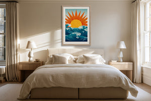 Framed sun and ocean illustration centered above a bed with cream bedding.