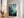 Emerald mountain canvas wall art styled in a calm neutral interior