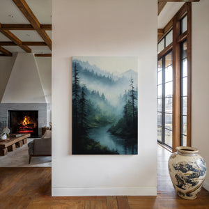 Canvas wall art of misty mountains, pines, and a calm river. A tranquil forest print in soft blues and greens. Ready to hang.