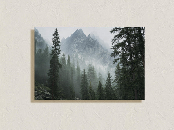 Canvas wall art of alpine evergreens and misty mountains. A tranquil landscape print that brings calm and nature indoors. Ready to hang.