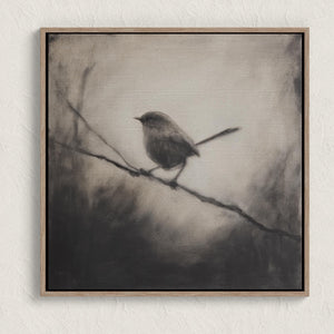 Canvas wall art of a solitary robin in black and white. A peaceful charcoal bird print, full of stillness. Ready to hang.