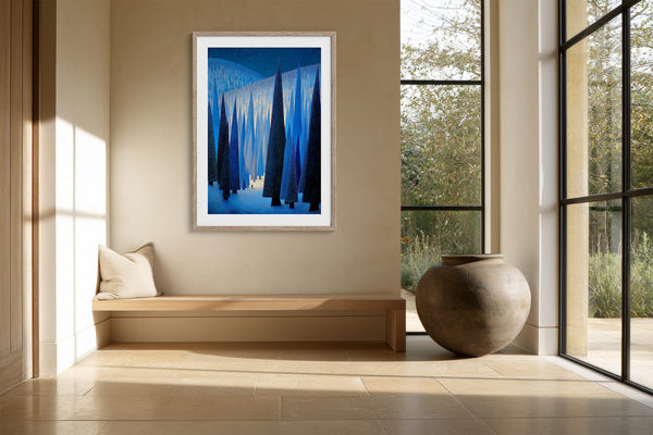 White-framed forest print above a built-in bench beside a large ceramic urn.