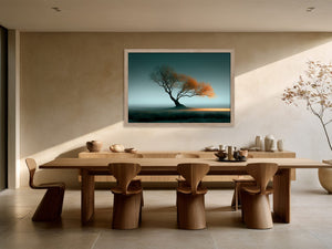 Leaning Light tree artwork in a light wood frame above a long dining table.