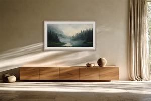 Mist Between the Pines in a pale frame hanging above a long wooden sideboard beside tall curtains.