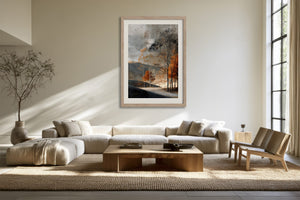 Light wood-framed autumn woodland print above a cream sectional sofa and low coffee table.