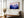Violet Ranges mountain artwork in a gold-toned frame above a wooden bench and vase.