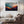 Framed wall art of layered mountains in twilight tones. Deep blues and sienna hues bring bold calm.