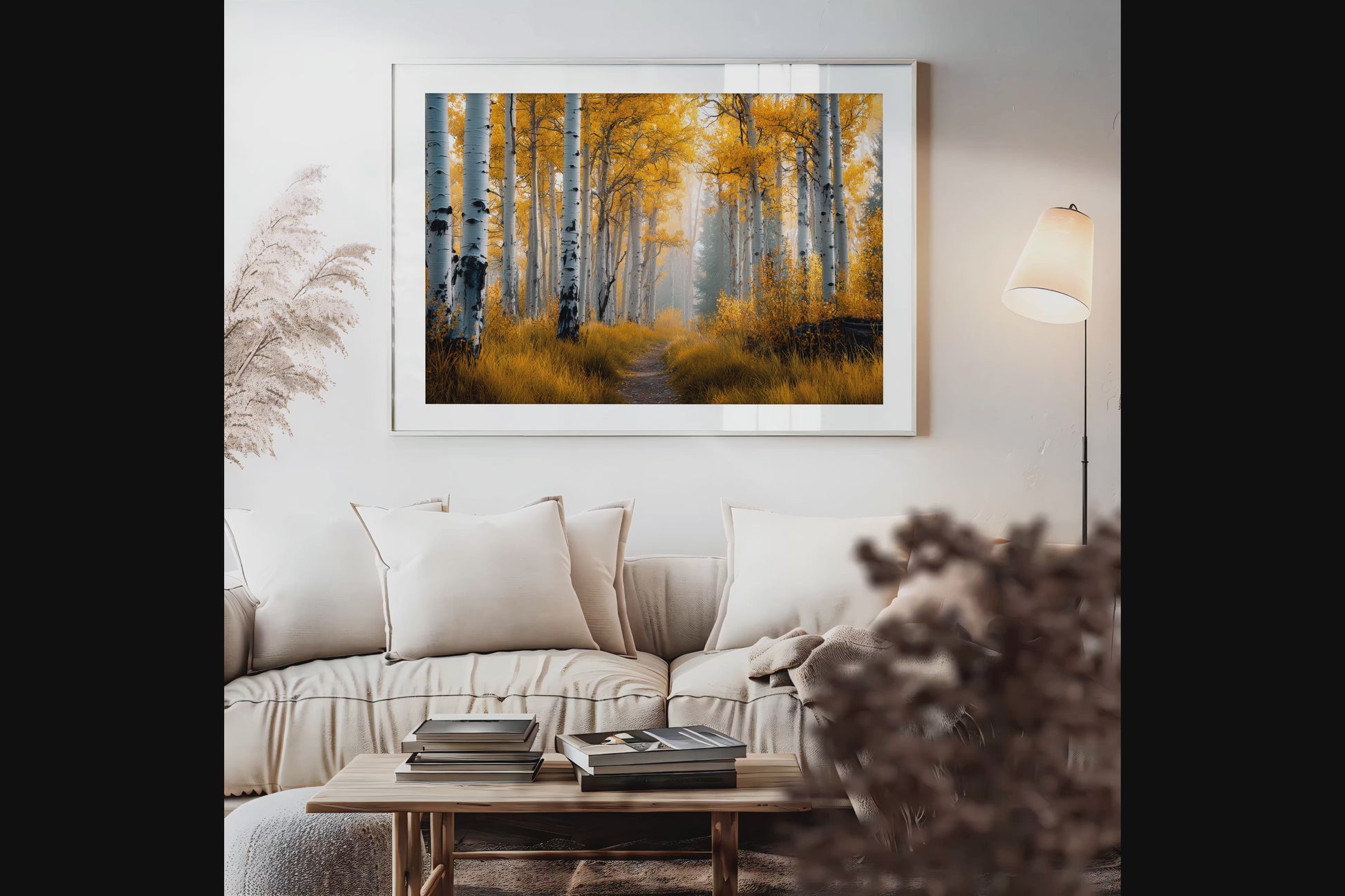 Framed wall art of silver birch trees glowing in golden light. A minimalist woodland print that brings calm and balance.