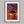 Solace at Sunrise shown in an oak frame with a white border or mount.