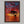 Solace at Sunrise shown in a walnut frame without a border or mount.