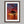 Solace at Sunrise shown in a walnut frame with a white border or mount.