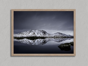 Silent Mirror shown in an oak frame without a border or mount.