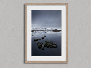 Quiet Reflections shown in an oak frame with a white border or mount.
