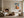 Framed geometric hare artwork in a living area with fireplace, sofa, and round chair.