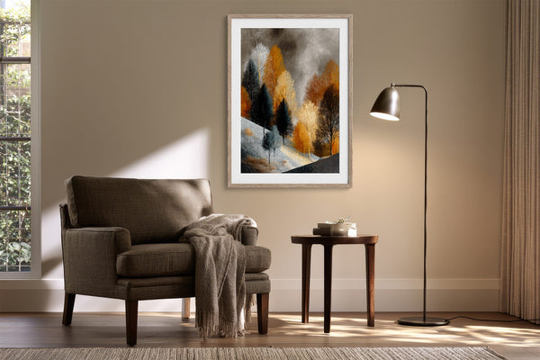Framed winter tree artwork above an armchair beside a floor lamp and small table.