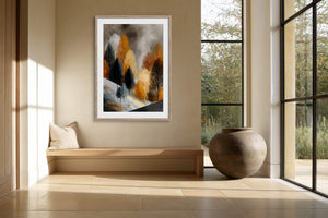 Framed winter tree artwork above a built-in bench beside a large ceramic vessel.