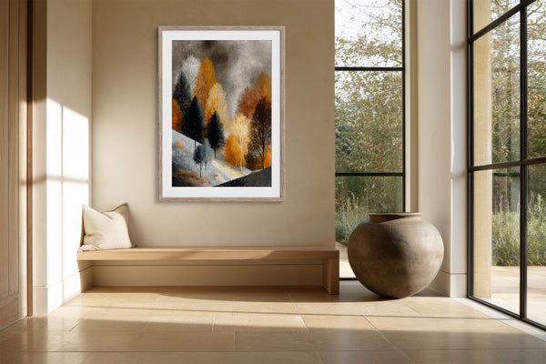 Framed winter tree artwork above a built-in bench beside a large ceramic vessel.