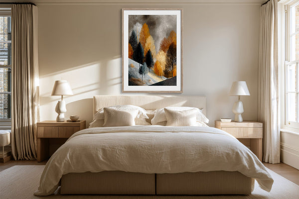 Framed winter tree artwork centered above a bed with matching bedside lamps.