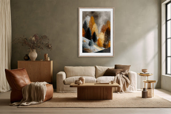 Framed winter tree artwork above a cream sofa with a wooden coffee table.