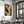Large dark-framed winter tree artwork displayed above a formally set dining table.