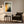 Framed Copper Veil artwork above a dark armchair, side table, and floor lamp.