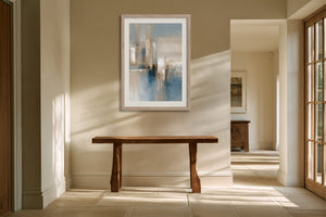 Blue Foundations I in a light wood frame above a rustic wooden console in a sunlit hallway.