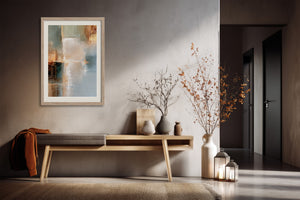 Framed Copper Shore abstract artwork above a wood console with vases and branches.