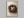 Three Small Beginnings shown in an oak frame without a border or mount.