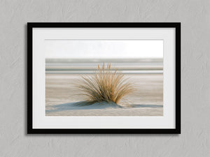Dune Stillness shown in a black frame with a white border or mount.
