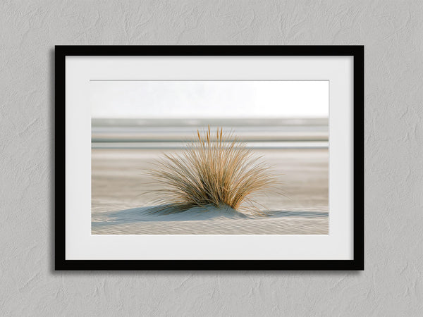 Dune Stillness shown in a black frame with a white border or mount.