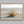 Dune Stillness shown in an oak frame without a border or mount.