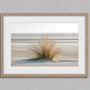 Dune Stillness shown in an oak frame with a white border or mount.