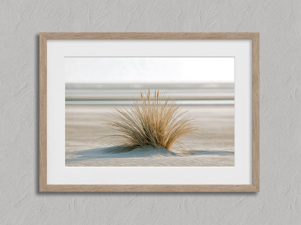 Dune Stillness shown in an oak frame with a white border or mount.