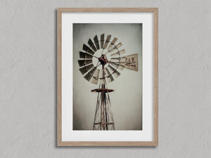 Prairie Windmill shown in an oak frame with a white border or mount.