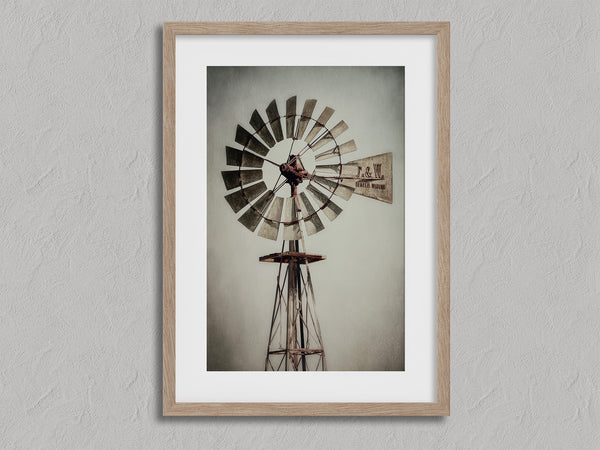 Prairie Windmill shown in an oak frame with a white border or mount.