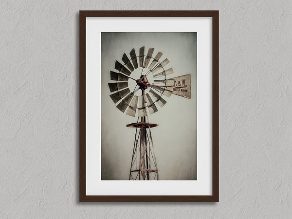 Prairie Windmill shown in a walnut frame with a white border or mount.
