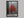 Scarlet Stillness shown in a black frame without a border or mount.