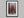 Scarlet Stillness shown in a black frame with a white border or mount.